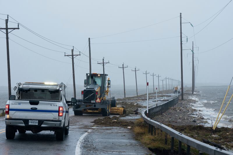 A road is blocked by debris thrown ashore by Storm Fiona near Les Iles-de-la-Madeleine, Quebec. Photograph: Nigel Quinn/The Canadian Press via AP
