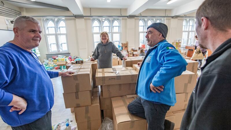 Caitriona Twomey and Chris O’Donovan and members of Cork Search and Rescue in the Collection Point of the North Cathedral Visitor Centre. Photograph: Michael Mac Sweeney/Provision