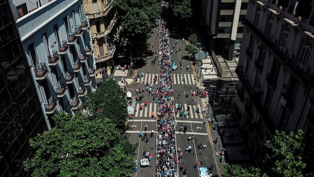 An aerial view of people queueing along Avenida de Mayo in Buenos Aires to reach the Casa Rosada presidential palace to pay tribute to Diego Maradona. Photograph:  Ivan Pisarenko/AFP via Getty Images