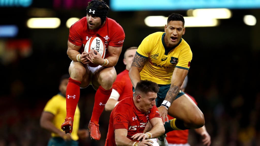 Leigh Halfpenny of Wales catches the ball ahead of Israel Folau of Australia, whilst Josh Adams of Wales is caught in between during the November international   at the  Principality stadium  in Cardiff. Photograph: Michael Steele/Getty Images