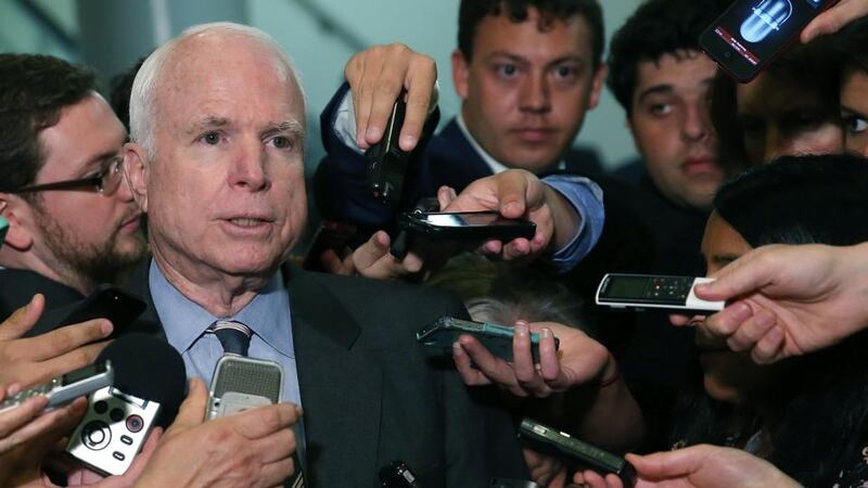 US senator John McCain talks to reporters after leaving a closed door meeting about Syria at the US Capitol. Photograph: Mark Wilson/Getty Images