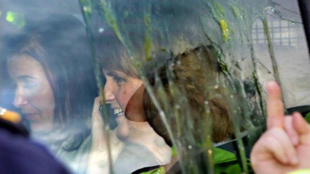 Garda protect Tánaiste Joan Burton from anti-water charge demonstrators as she tries to leave Jobstown yesterday