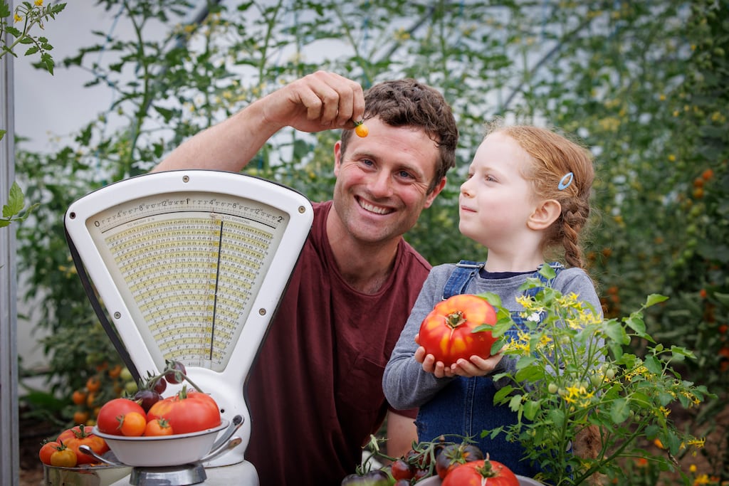 Colm O'Driscoll, head gardener at Airfield Estate is pictured with Ciara Diamond (6) from Firhouse Co Dublin at the launch of the Totally Terrific Tomato Festival at Airfield Estate this August.