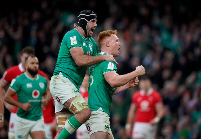 Ciarán Frawley celebrates scoring a try on his Ireland debut with Caelan Dorisduring the Guinness Six Nations match against Wales at the Aviva Stadium. Photograph: Niall Carson/PA Wire