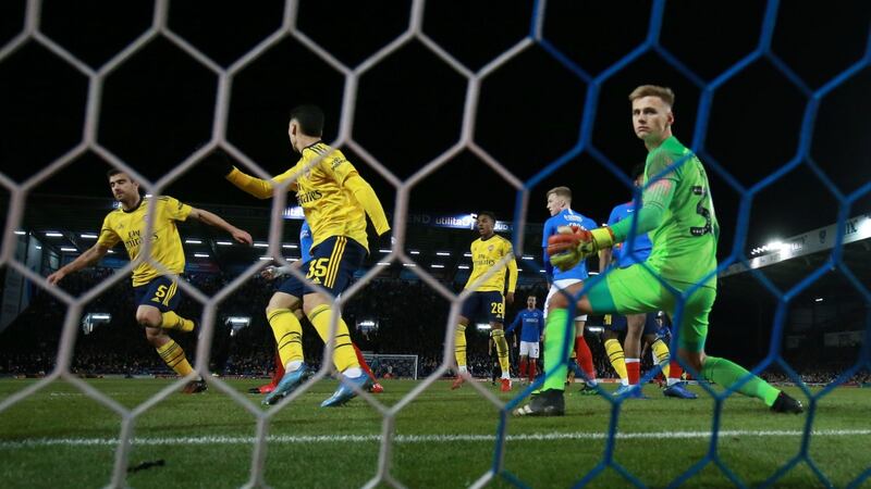 Sokratis Papastathopoulos scored Arsenal’s opener against Portsmouth. Photograph: Adam Davy/PA