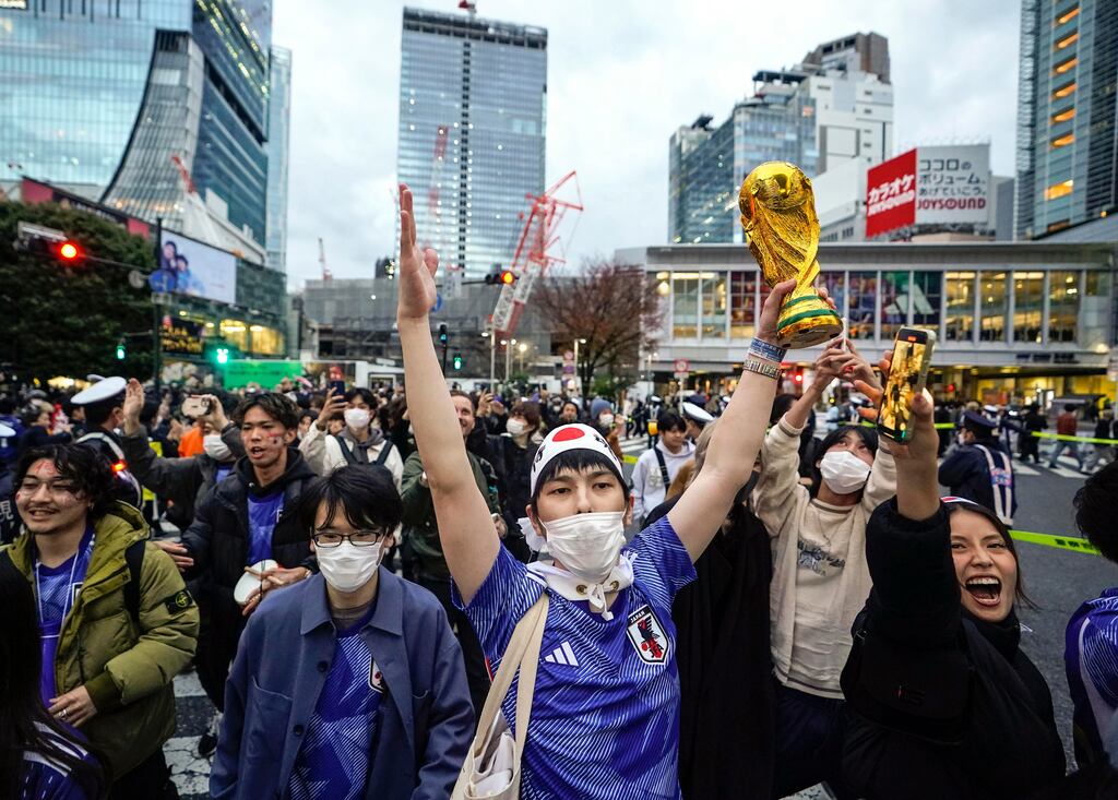 Japanese supporters celebrate their team's shock win over Spain which knocked Germany out of the World Cup. Photograph: Getty Images