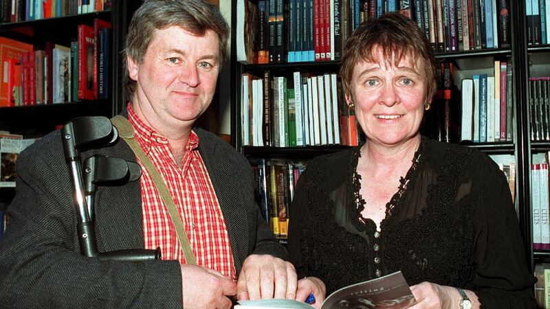 Evelyn Conlon signing her book, Telling, for Philip Casey at Waterstones. Photograph: Cyril Byrne