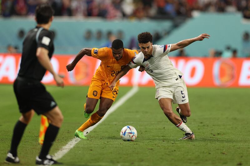 Netherlands' Denzel Dumfries fights for the ball with USA's Antonee Robinson. Photograph: Adrian Dennis/AFP via Getty Images)