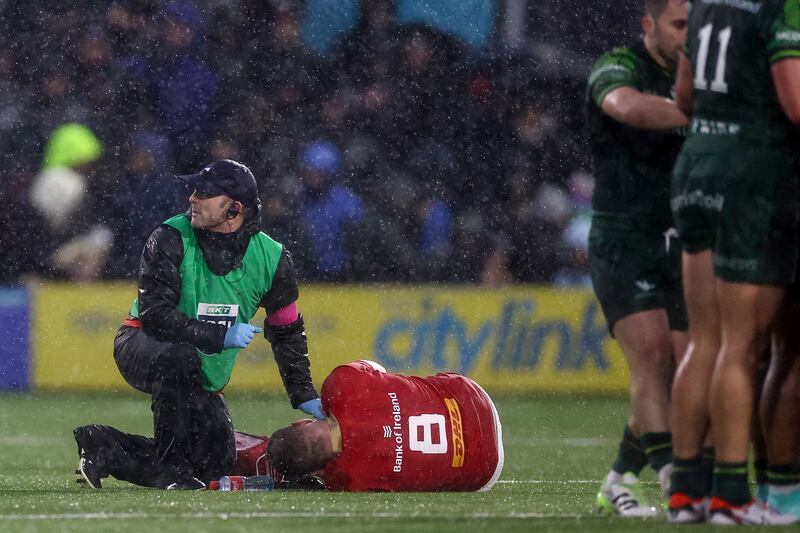 Munster's Jack O'Donoghue goes down injured during the URC defeat to Connacht. Photograph: Ben Brady/Inpho