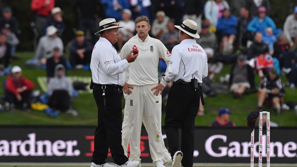 Umpires Marais Erasmus and Bruce Oxenford talk to Joe Root on day four of the second Test. Photograph: Kai Schwoerer/Getty