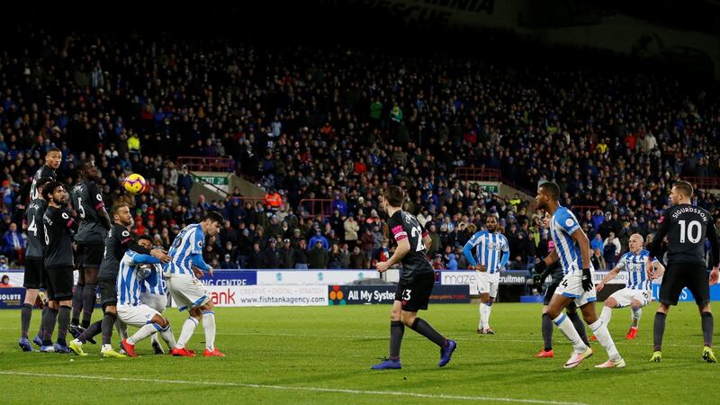Huddersfield Town’s Aaron Moy takes a free kick. Photograph: Andrew Yates/Reuters