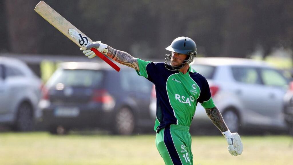Ireland’s John Mooney acknowledges the crowd after receiving a standing ovation after reaching 96 runs in Malahide. Photograph: Ryan Byrne / Inpho