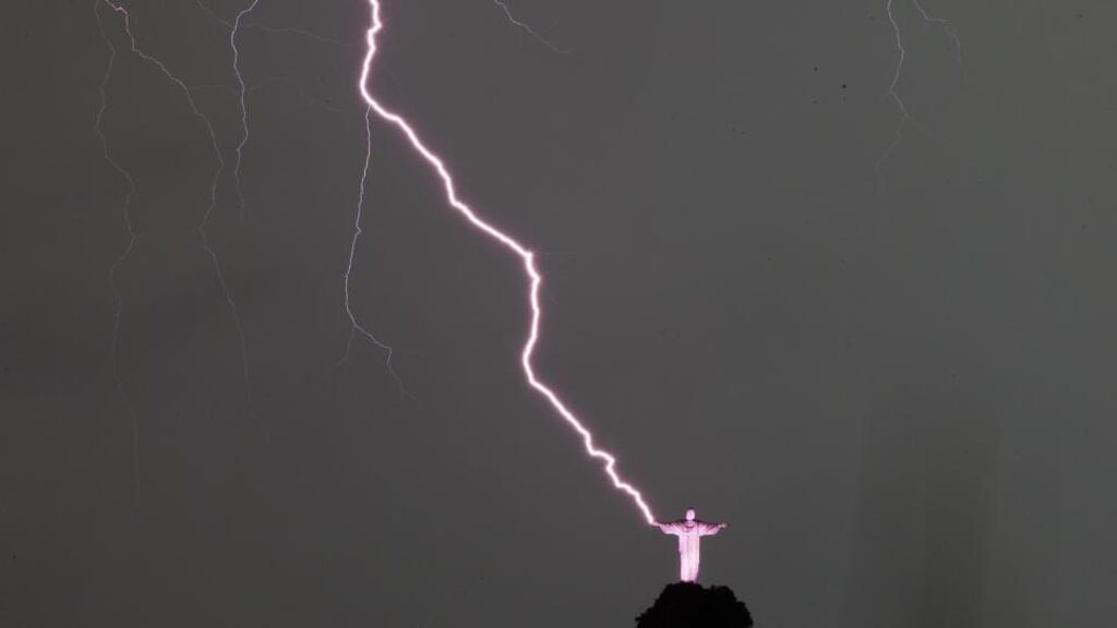 View of lightning that strikes next to the statue Christ the Redeemer in Rio de Janeiro, Brazil. Photograph: Antonio Lacerda/EPA.
