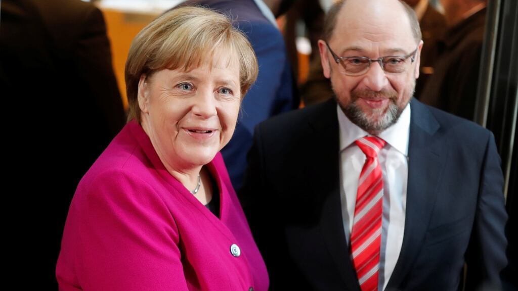 Acting German chancellor Angela Merkel and Social Democratic Party leader Martin Schulz before exploratory talks. Photograph: Hannibal Hanschke/Reuters