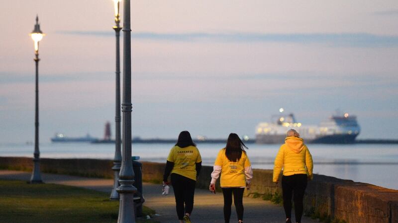 Walkers in the Clontarf area of Dublin. Photograph: Dara Mac Dónaill
