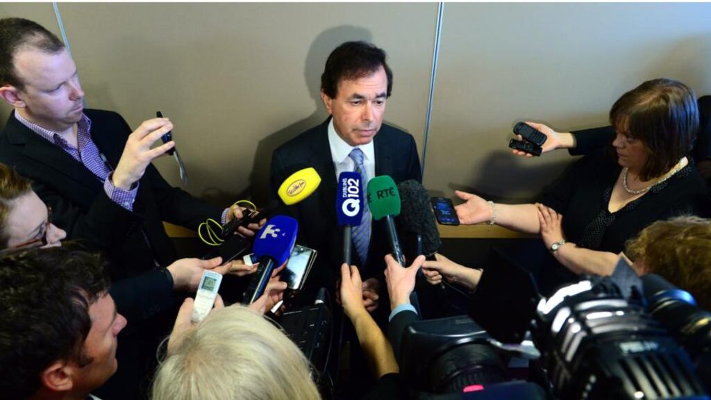 Minister for Justice Alan Shatter takes questions from the media on the Wallace controversy outside a citizenship ceremony in the Convention Centre in Dublin. Photograph: Bryan O’Brien/The Irish Times