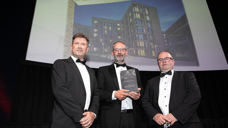 Noel McKernan, General Manager, HALT, presents the Housing Project of the Year award to Rob Keane and Nicolas Doyle, Reddy Architecture + Urbanism.