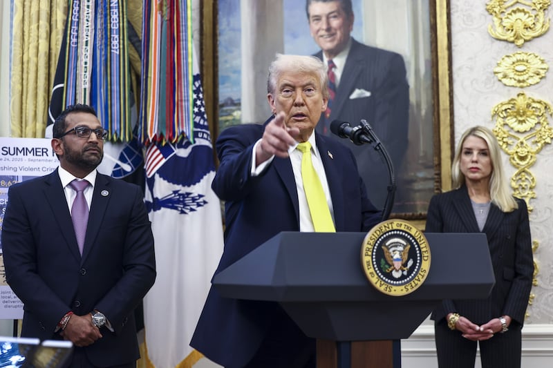 US president Donald Trump, with FBI director Kash Patel (L) and attorney general Pam Bondi (R) at the news media yesterday. Photograph: EPA