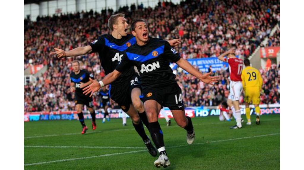 Mirror Image: Javier Hernandez (R), closely followed by Darren Fletcher, celebrates after scoring two goals, one in either half, to give Manchester United their first away win against Stoke at the Britannia Stadium. (Photograph: Darren Staples/Reuters)
