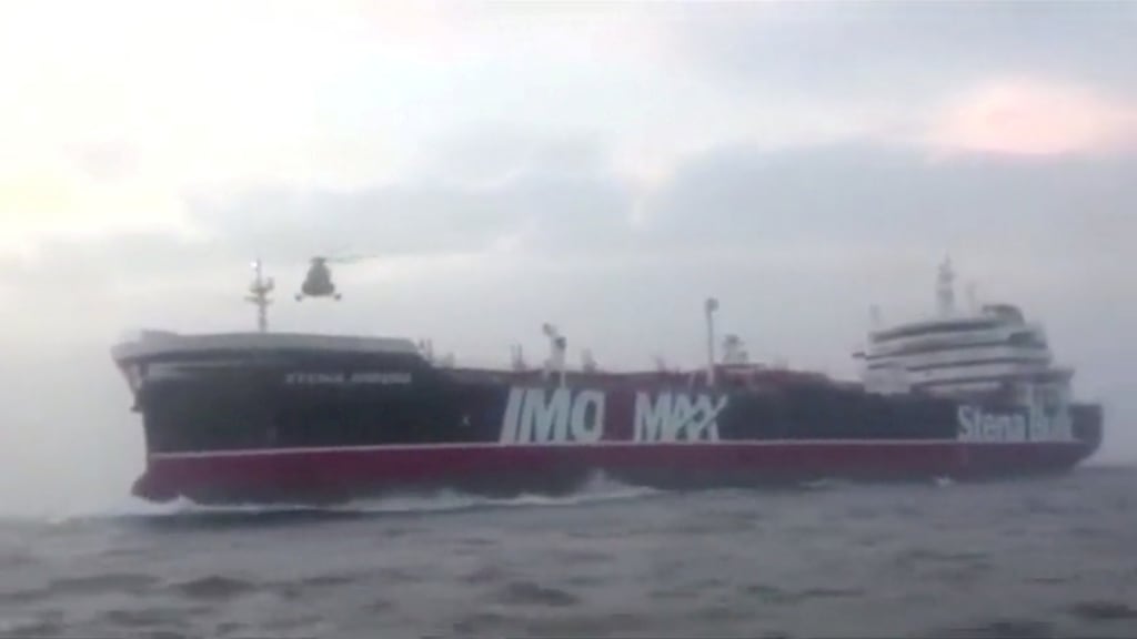 A helicopter hovers over the Stena Impero near the Strait of Hormuz: The government has been criticised by a former Royal Navy chief and a leading Conservative MP for failing to take measures to prevent the tanker being seized. Photograph: Wana/Reuters