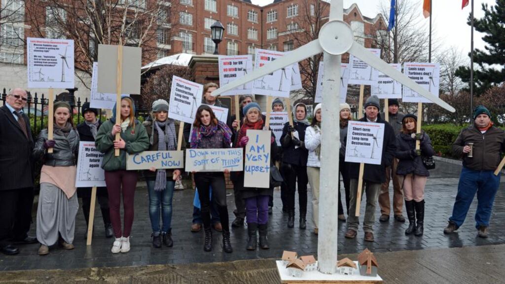 Protesters from the Laois Wind Energy Awareness Group, outside The Four Seasons Hotel yesterday, where the Irish Wind Energy Association annual conference was taking place, in Ballsbridge, Co Dublin, on Wednesday. Photograph: Eric Luke