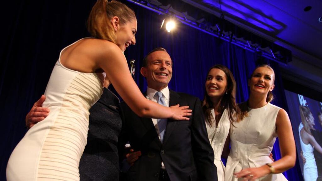 Australian prime minister-elect Tony Abbott is surrounded by his family after acknowledging his victory in the election today. Photograph: Lisa Maree Williams-Pool/Getty Images
