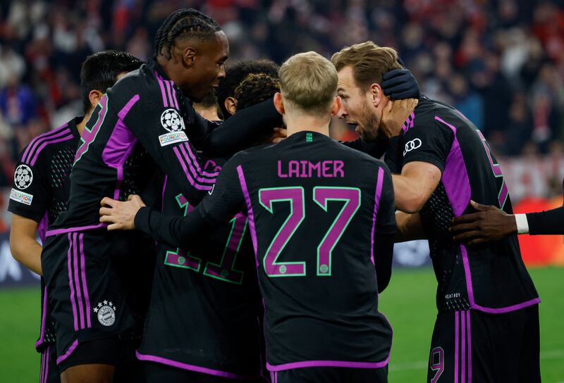 Harry Kane celebrates with team-mates after scoring the opening goal against Galatasaray in the Champions League. Bayern now face Lazio in the last 16 tie. Photograph: Michaela Rehle/AFP/Getty Images