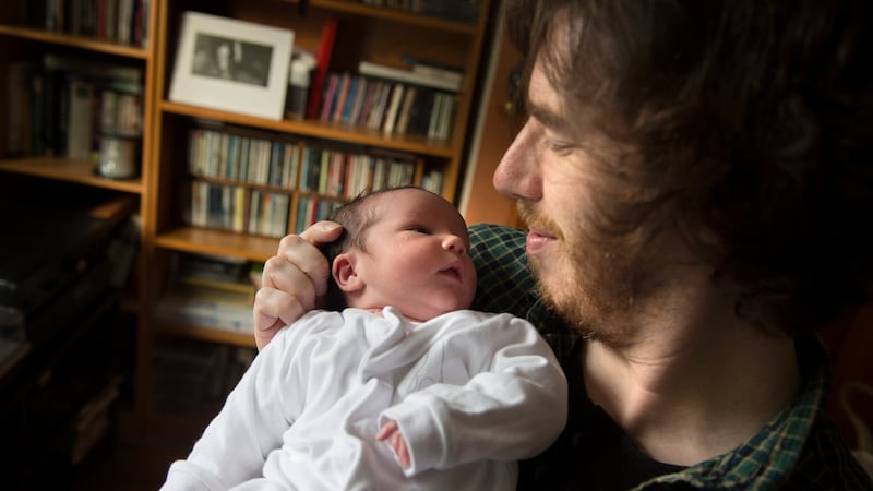 Joe Griffin and his six-day old daughter Alice, at home in Cabra, Dublin. Photograph: Dara Mac Dónaill