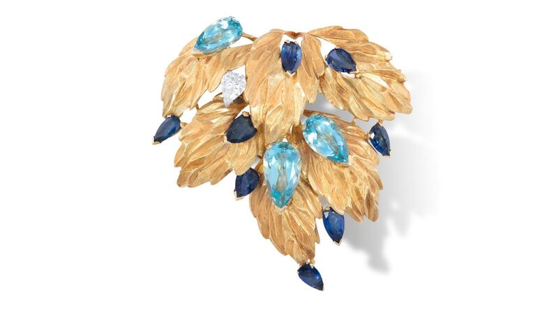 Lot 62, a pear-shaped aquamarine, sapphire and diamond brooch by Andrew Grima