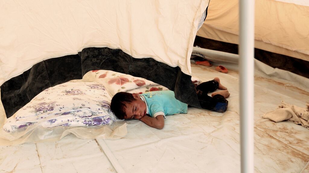 A  child displaced by Islamic State violence  in a tent at a refugee camp in the Makhmour area near Mosul, Iraq. Photograph: Ari Jalal/Reuters