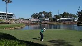 Day survives brutal Sawgrass conditions to lead by four