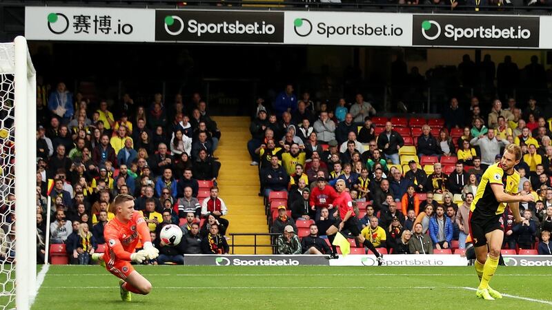 Craig Dawson’s header is saved by Dean Henderson of Sheffield United at Vicarage Road. Photograph:  Marc Atkins/Getty Images