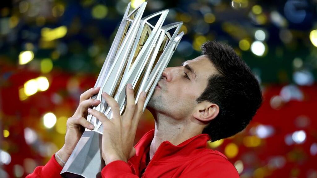 Novak Djokovic of Serbia with the winner’s trophy after defeating Juan Martin Del Potro of Argentina at the Shanghai Masters at the Qi Zhong Tennis Centre. Photograph: Matthew Stockman/Getty Images