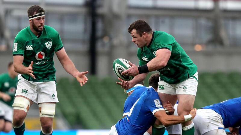 Cian Healy offloads to Caelan Doris during the Six Nations game against Italy at the Aviva Stadium. Photograph: Bryan Keane/Inpho