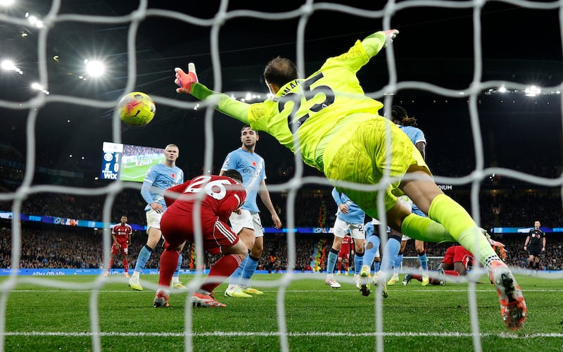 Andy Robertson ducks as the header by Virgil van Dijk of Liverpool goes over him - the goal was ruled out for offside. Photograph: Michael Regan/Getty Images
