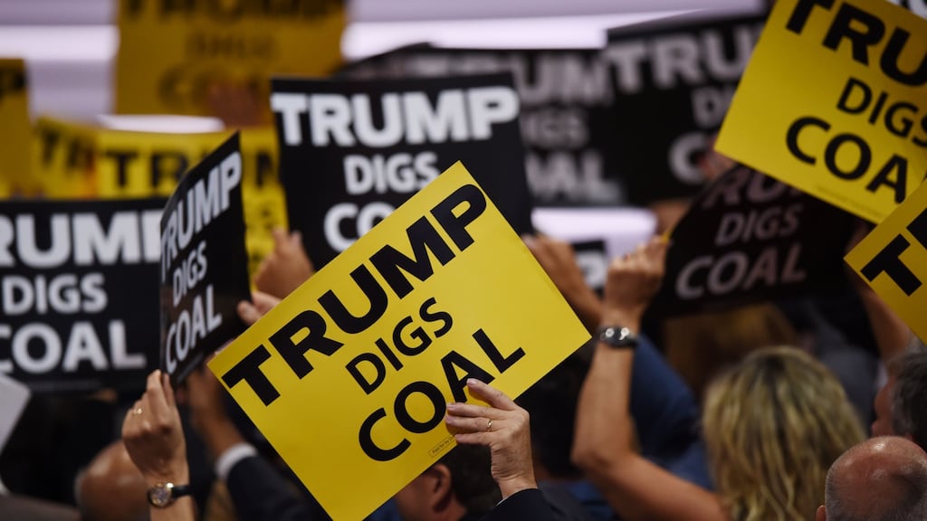 Signs supporting Republican presidential candidate Donald Trump are held during the Republican National Convention in Cleveland, Ohio. Photograph: Timothy A Clary/AFP/Getty Images