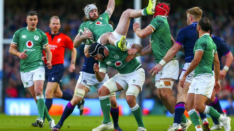 Ireland’s Mack Hansen lands atop Caelan Doris during the game against Scotland. Photograph: Ken Sutton/Inpho
