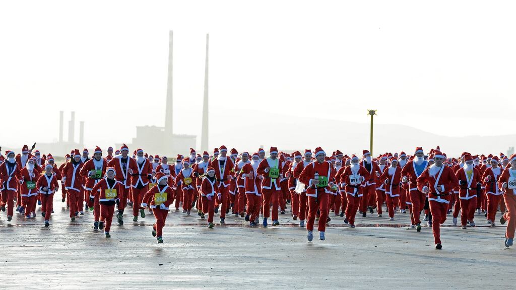 Some of the 1400 Santas taking part in The Santa Dash, a fundraiser for the Down Syndrome Center Charity, at North Bull Island , Dublin. Photograph: Eric Luke/The Irish Times