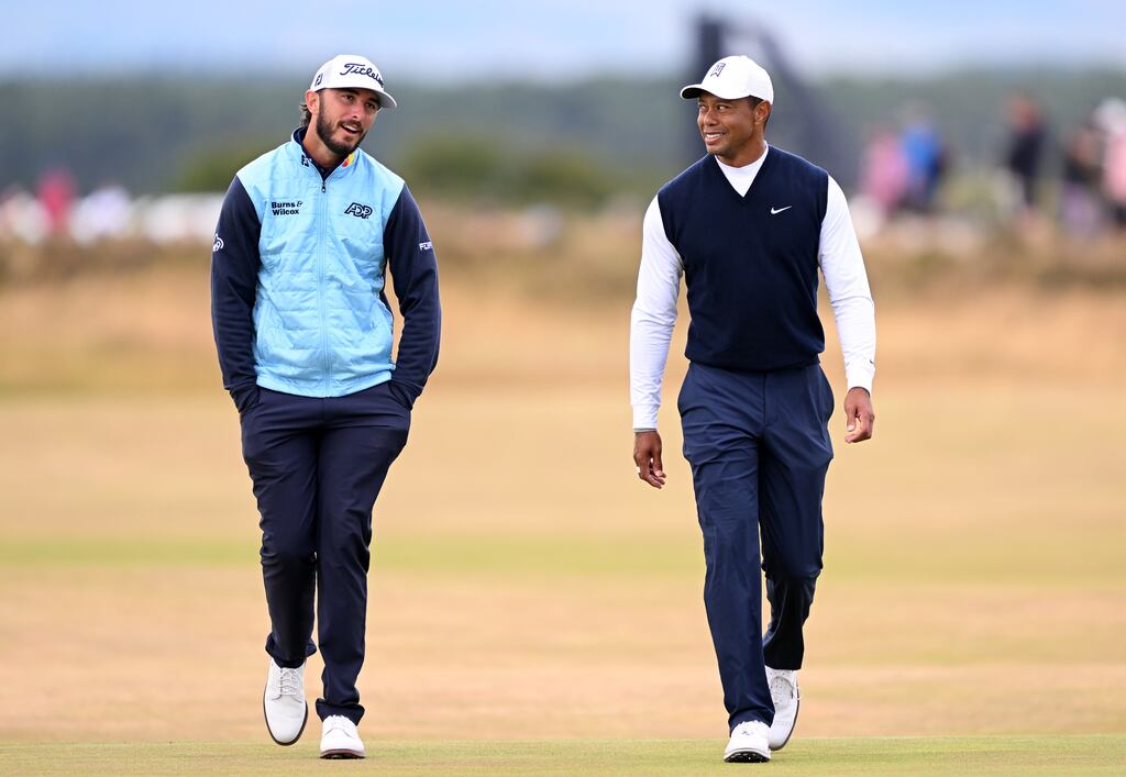 Max Homa and Tiger Woods chat during the first round of the Open Championship at St Andrews. Photograph: Ross Kinnaird/Getty Images