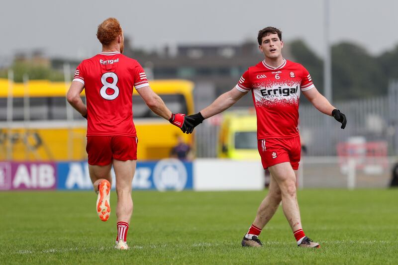 Derry's Pádraig McGrogan and Conor Glass celebrate a score in the game at Celtic Park. Photograph: Lorcan Doherty/INPHO