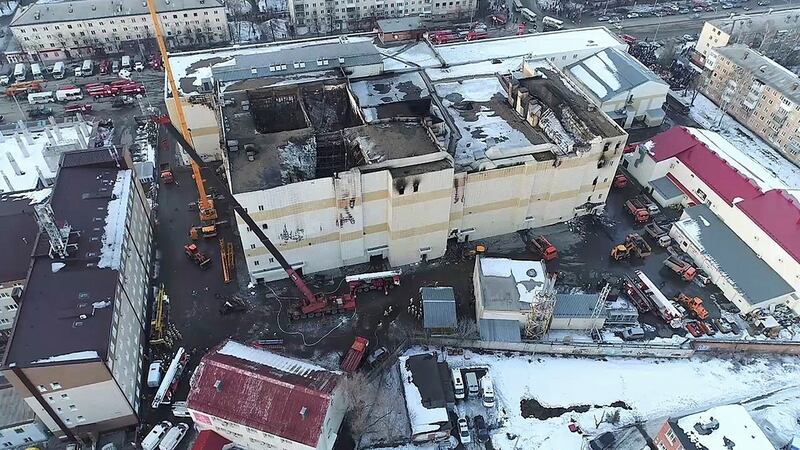An aerial view of emergency services cleaning up the wreckage at the scene of the shopping centre fire in Kemerovo. Photograph: Russian Ministry for Emergency Situations/AP