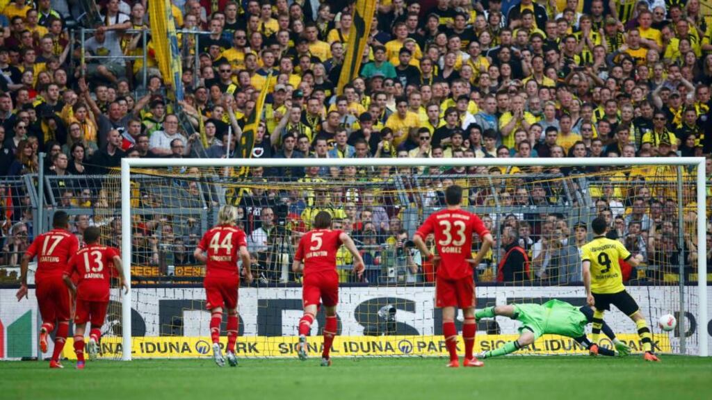 Borussia Dortmund’s Robert Lewandowski has his penalty saved by Bayern Munich goalkeeper Manuel Neuer during the Bundesliga match in Dortmund. Photograph: Lisi Niesner