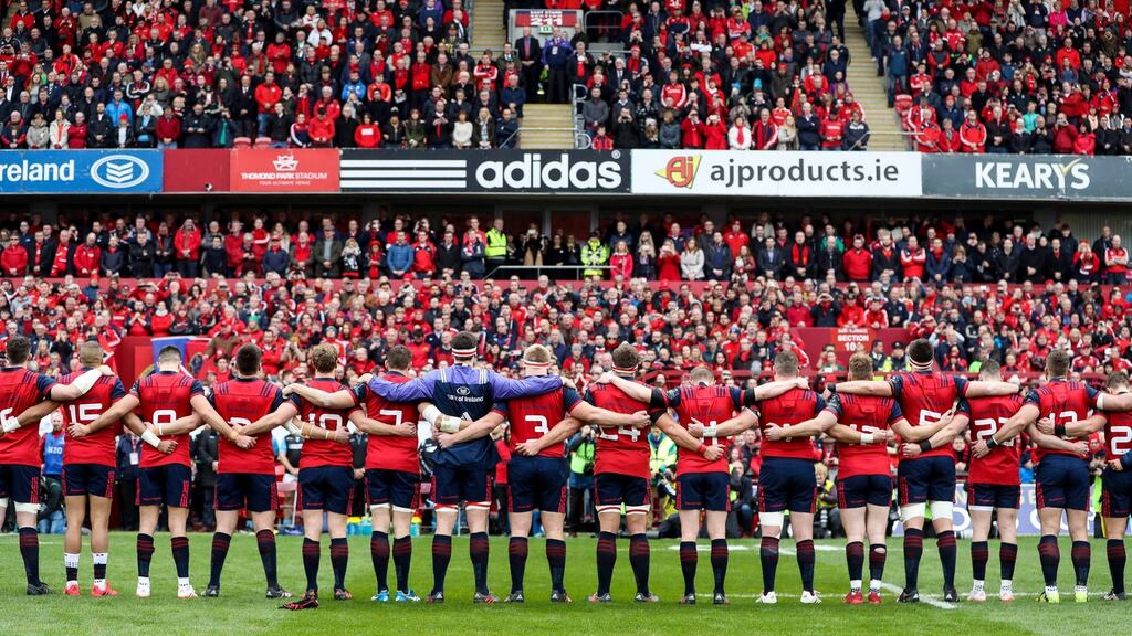 The Munster squad stand for a minute’s silence for Anthony Foley before Saturday’s stirring victory over Glasgow. Photograph: Tommy Dickson/Inpho