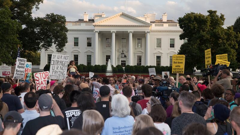 Protesters outside the White House demonstrate against the violence that took place at a white nationalist rally in Charlottesville, Virginia. Photograph: Michael Reynolds/EPA