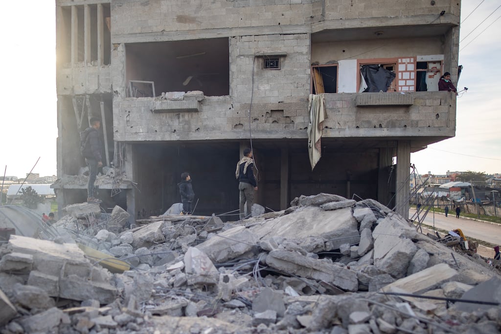 Palestinians inspect their destroyed houses following an Israeli airstrike on the Rafah refugee camp on Monday. Photograph: Haitham Imad/EPA
