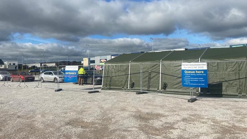 Cars queue up for the drive-through flu vaccine clinic. Photograph: Mike Thompson