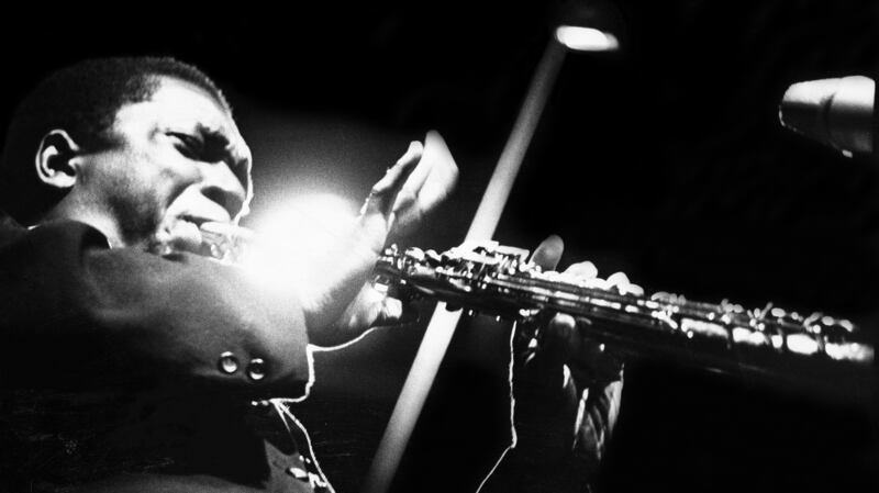 John Coltrane performs at the Half Note club, New York, in 1965. Photograph: Adam Ritchie/Redferns