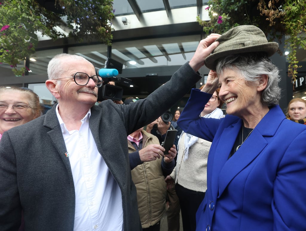 Catherine Connolly tries on a hat as she canvasses in Navan Shopping Centre today.  Photograph: Leah Farrell / © RollingNews.ie
