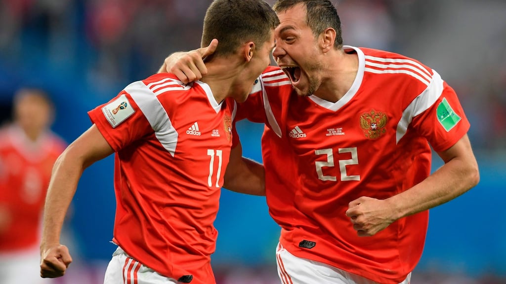 Russia’s midfielder Roman Zobnin and Russia’s forward Artem Dzyuba celebrate the opening goal against Saudi Arabia  at the Saint Petersburg Stadium. Photograph: Gabriel Bouys/AFP/Getty