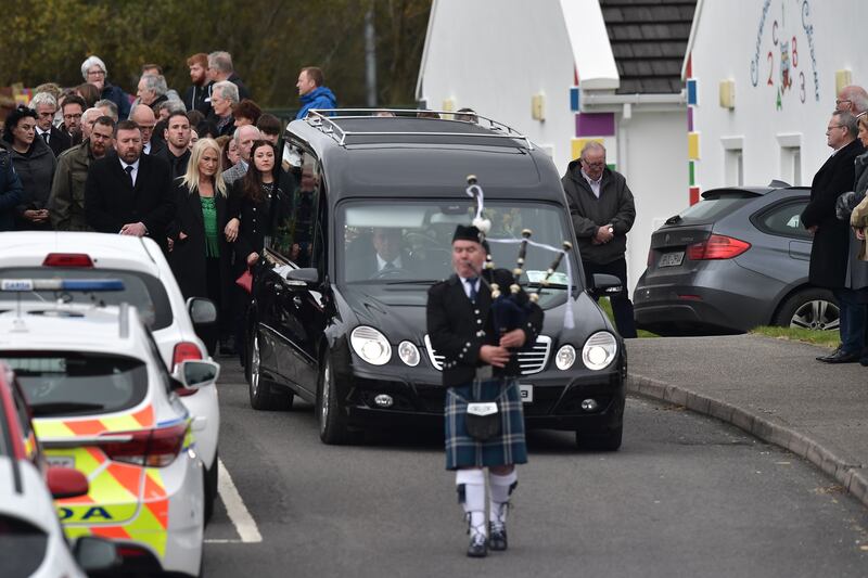 Mourners watch the arrival of the hearse carrying the remains of Martin McGill to St Michael's Church in Creeslough on Tuesday. Photograph: Charles McQuillan/Getty Images